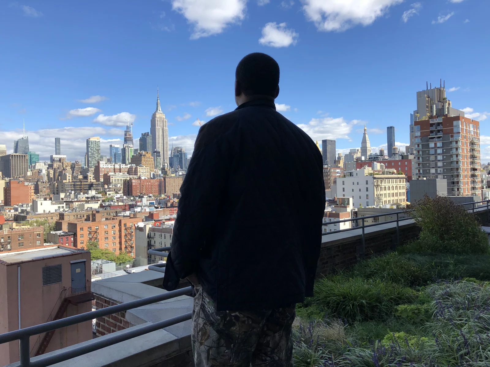 Wiley looking out over the New York City skyline