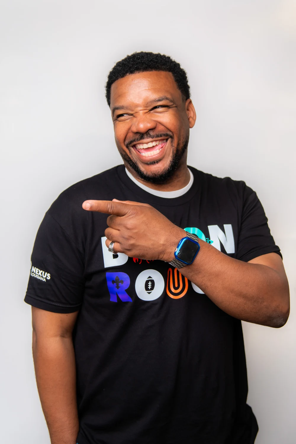 Wiley smiling and pointing while engaging an audience